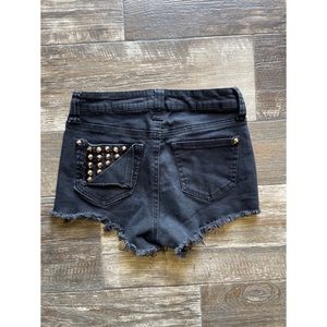 Studded denim cutoff shorts